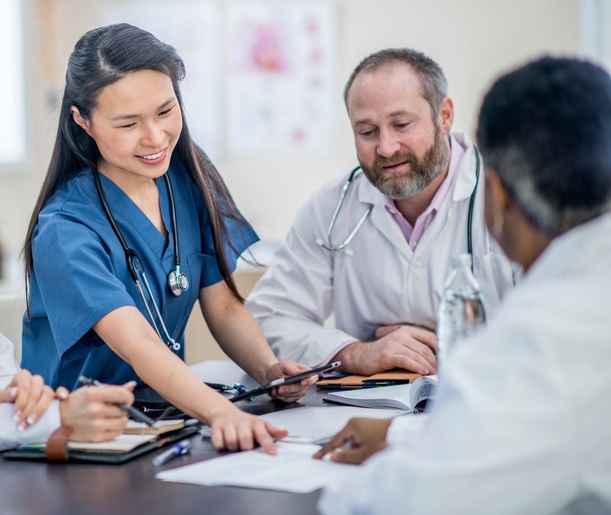 Doctors discussing a policy